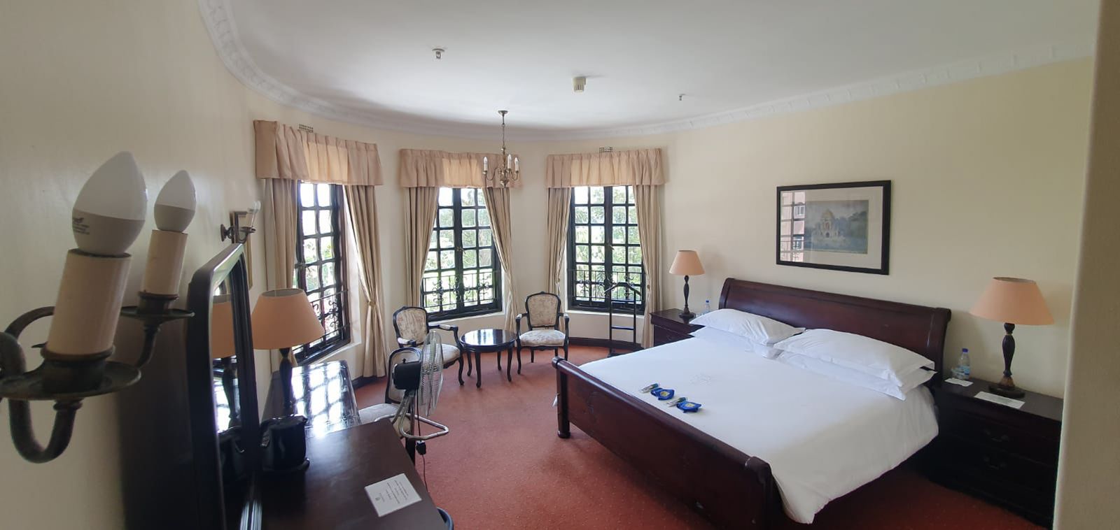 A Royal Room with its teak sleigh bed and turret windows